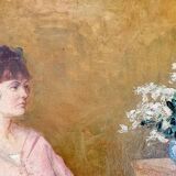 Huile sur toile - non signée - représente une femme assise à côté d'un vase de fleurs.