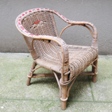 Desk with rattan and wicker armchair for children