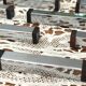 Set of 12 Art Deco Modernist knife rests in chrome metal and blackened wood.