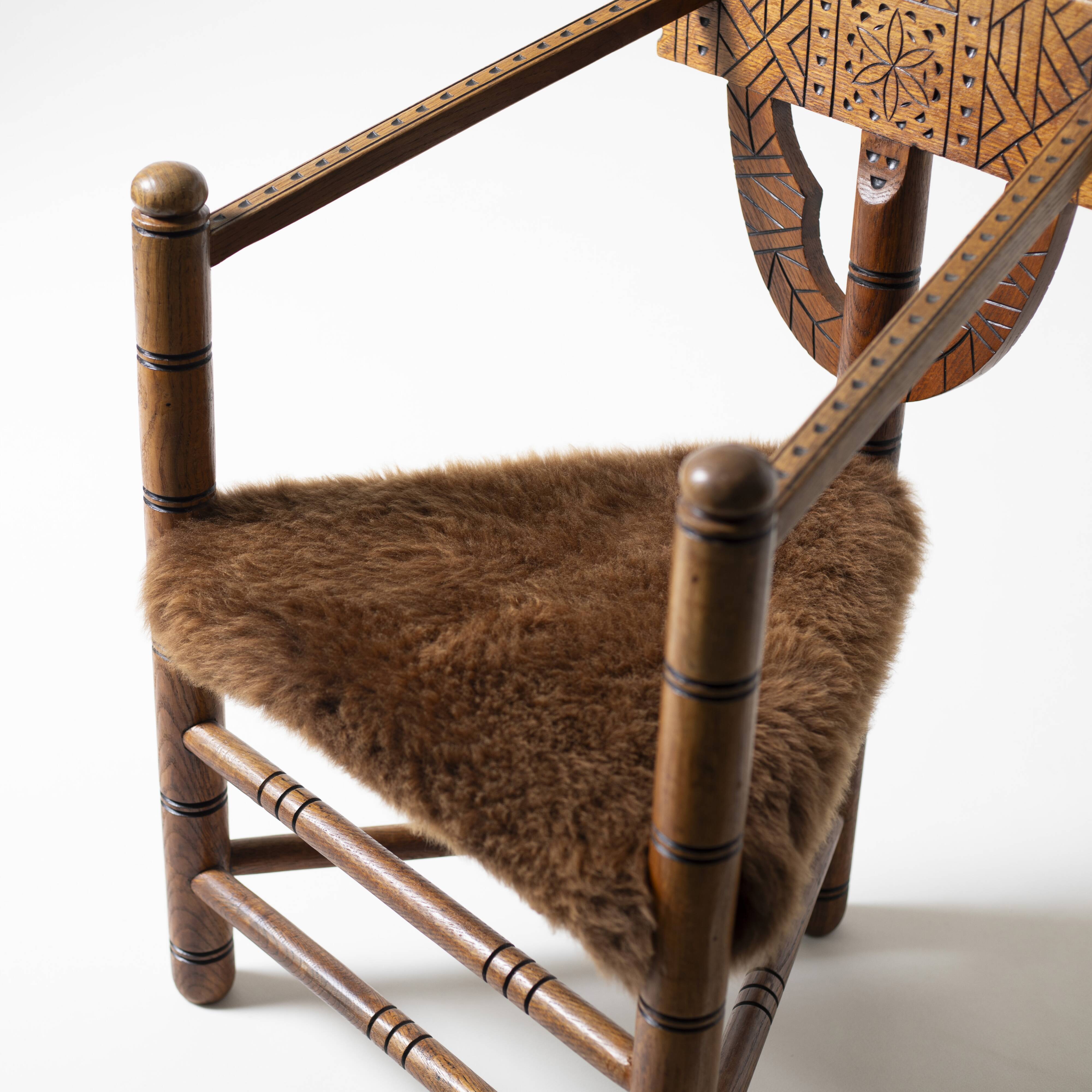 Hand carved brutalist  / folk 'Monk' chair, reupholstered in sheepskin, Swe