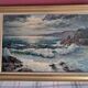 Old oil painting depicting a seascape.