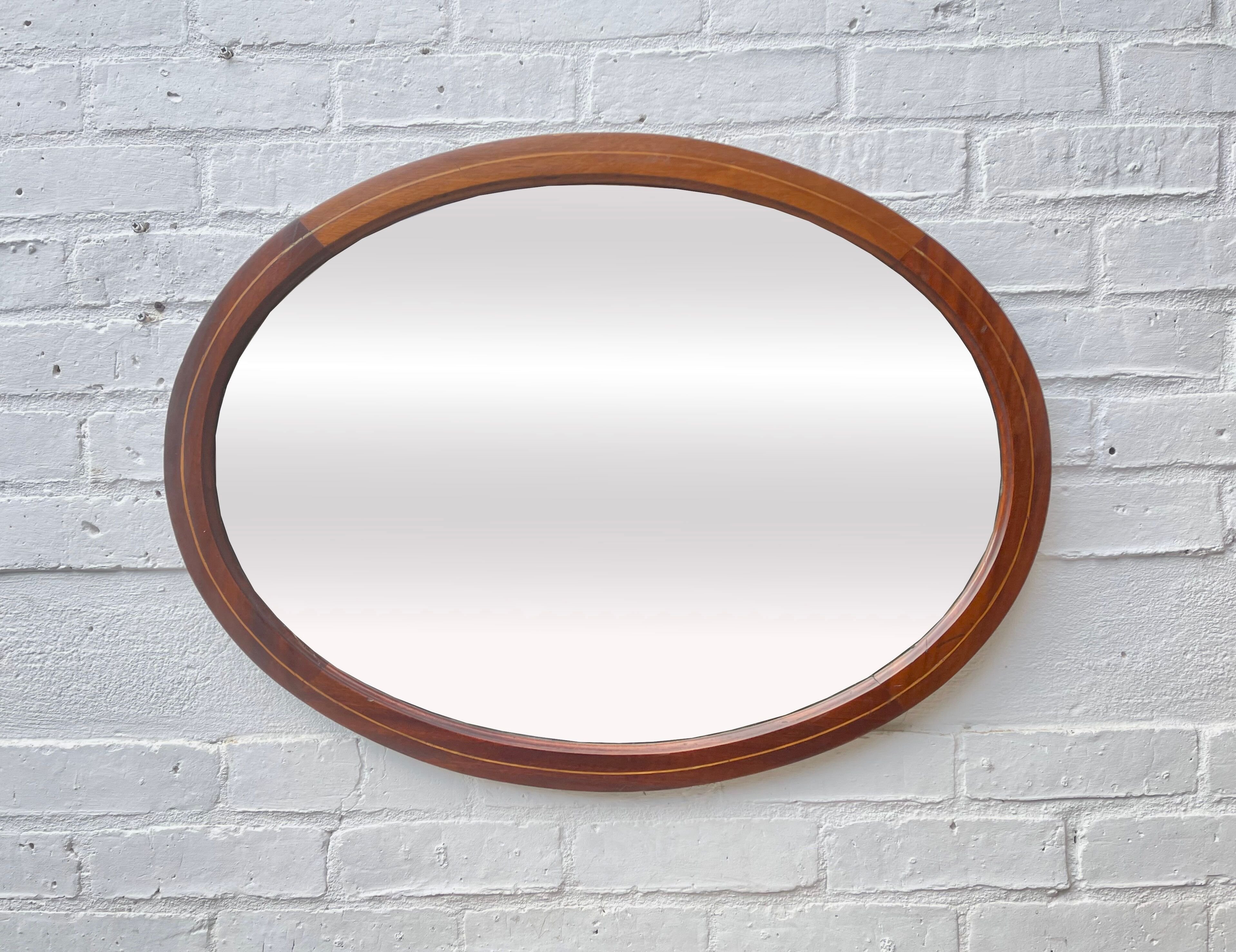Vintage oval bevelled mirror mahogany frame