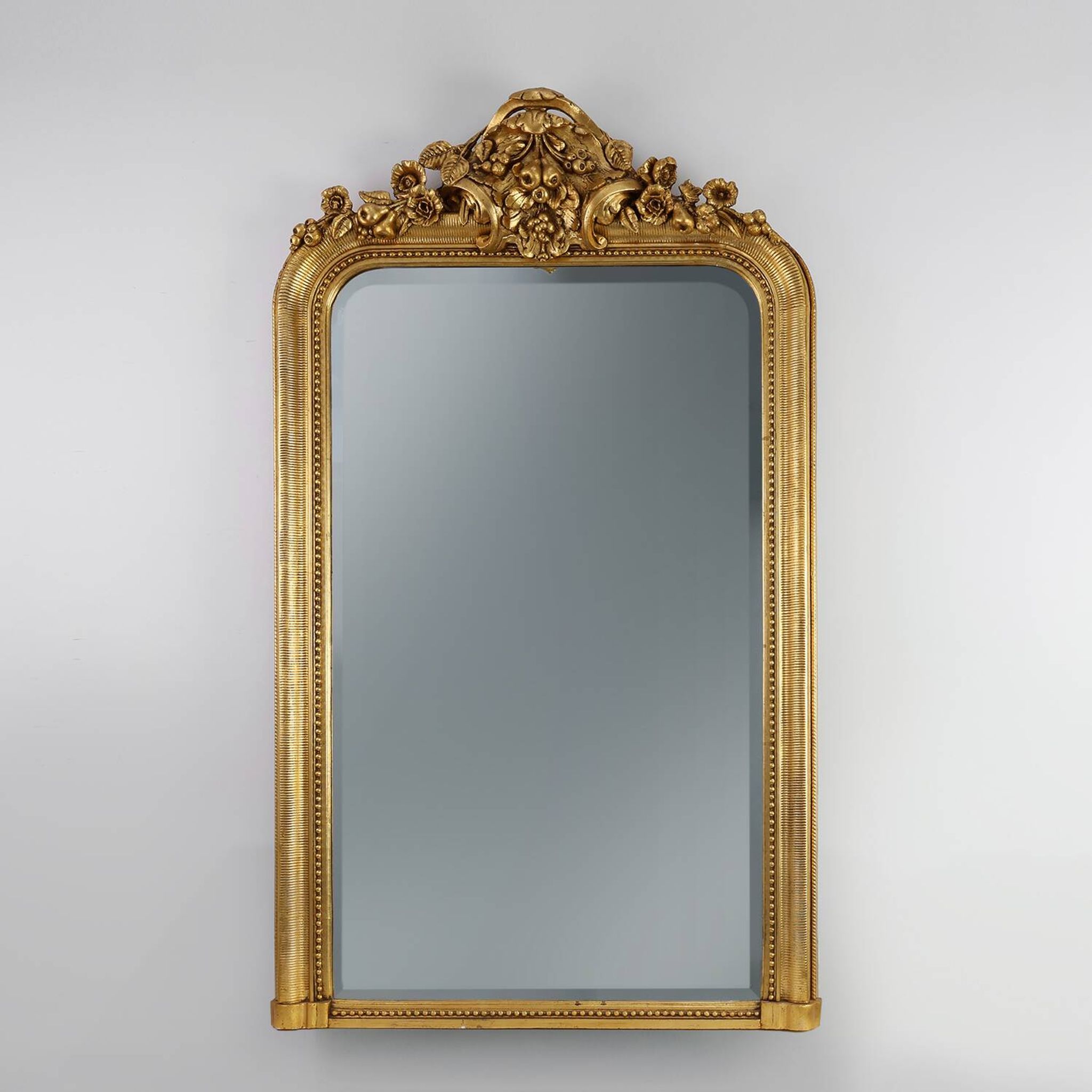 Baroque mantel mirror in carved wood and gilded plaster, France circa 1850.