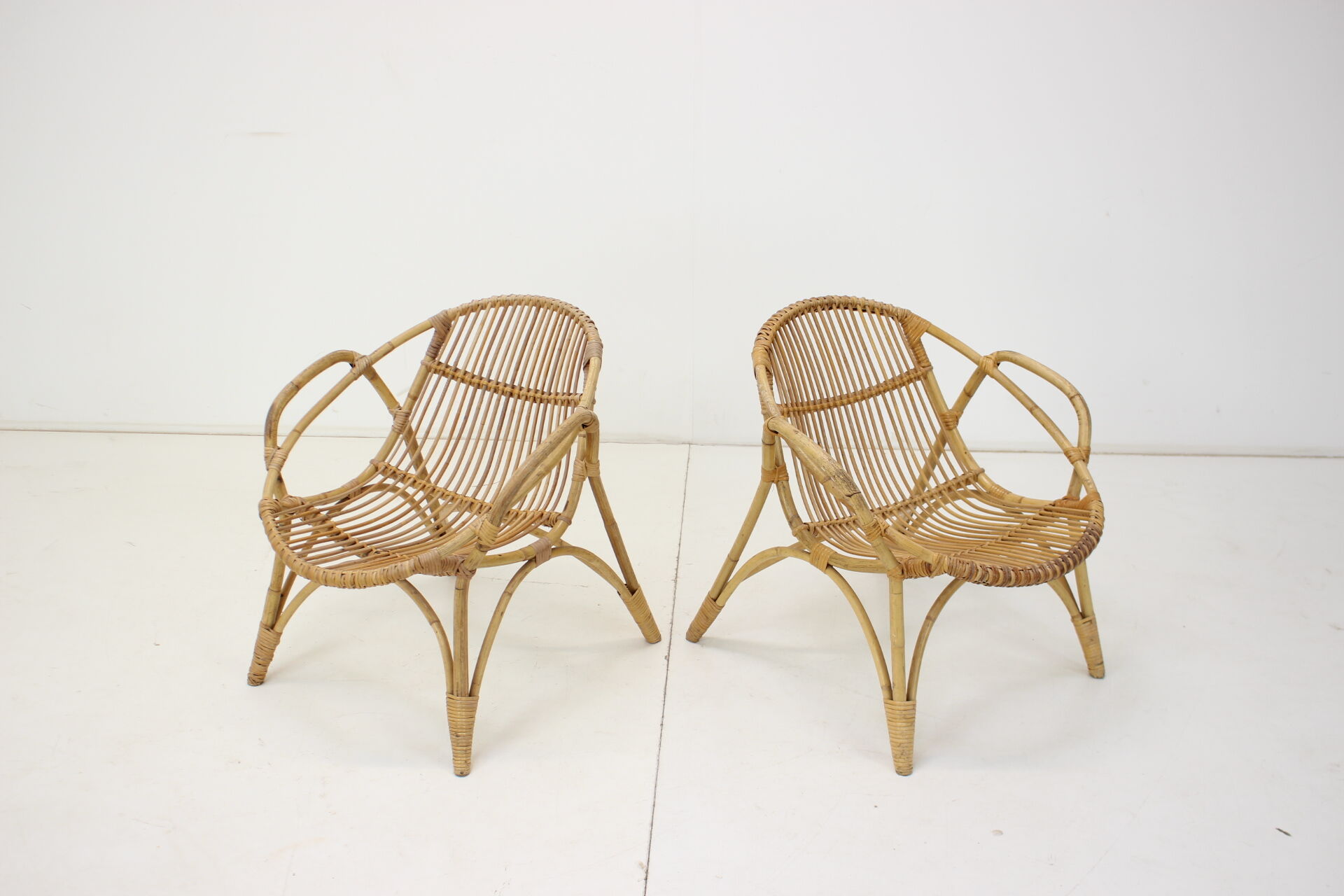 Pair of Alan Fuchs rattan lounge chairs, Czechoslovakia, 1960s