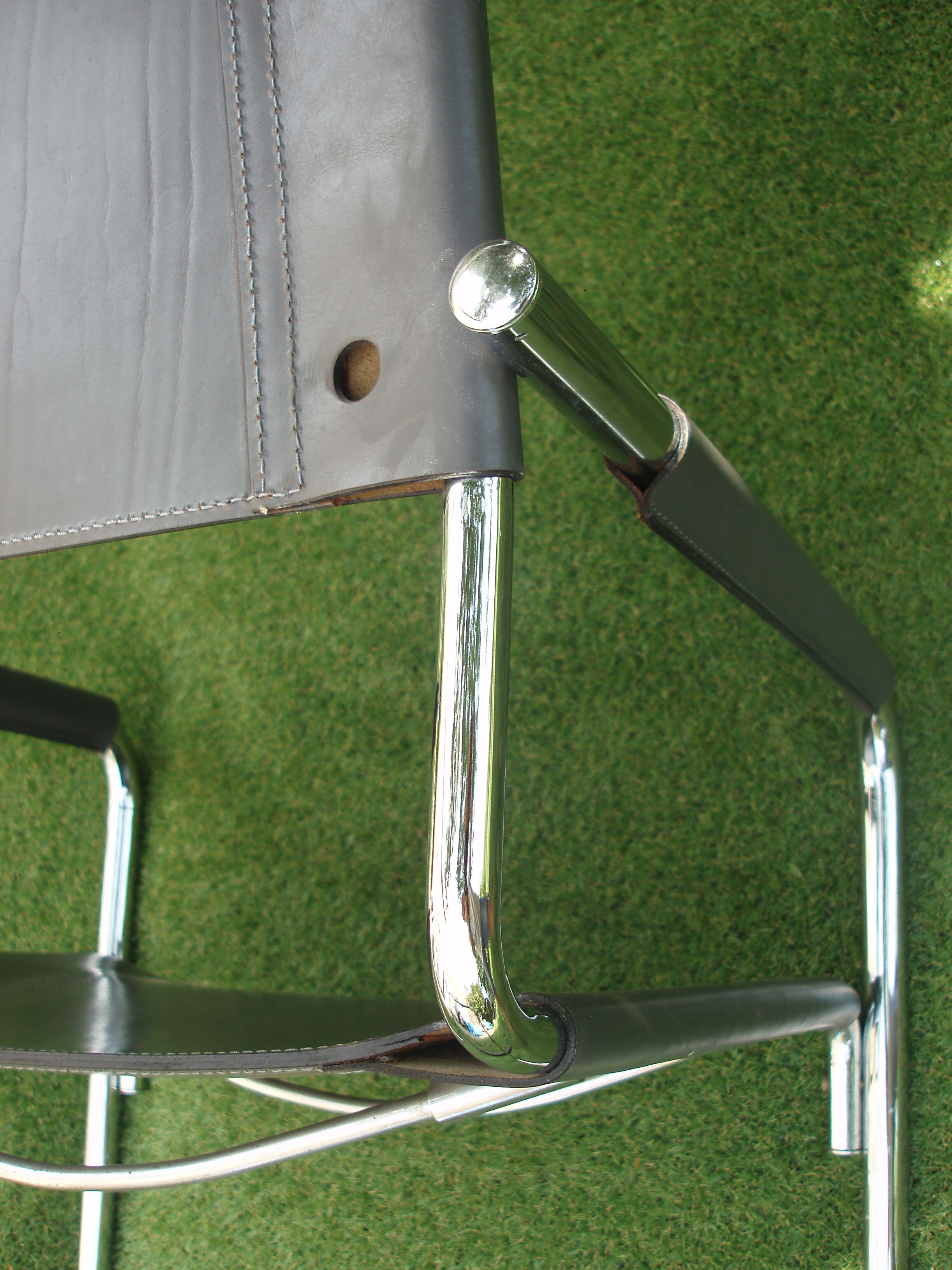 Series of grey and chrome leather armchairs