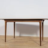 Extendable teak dining table in Mid-Century style from McIntosh, UK.