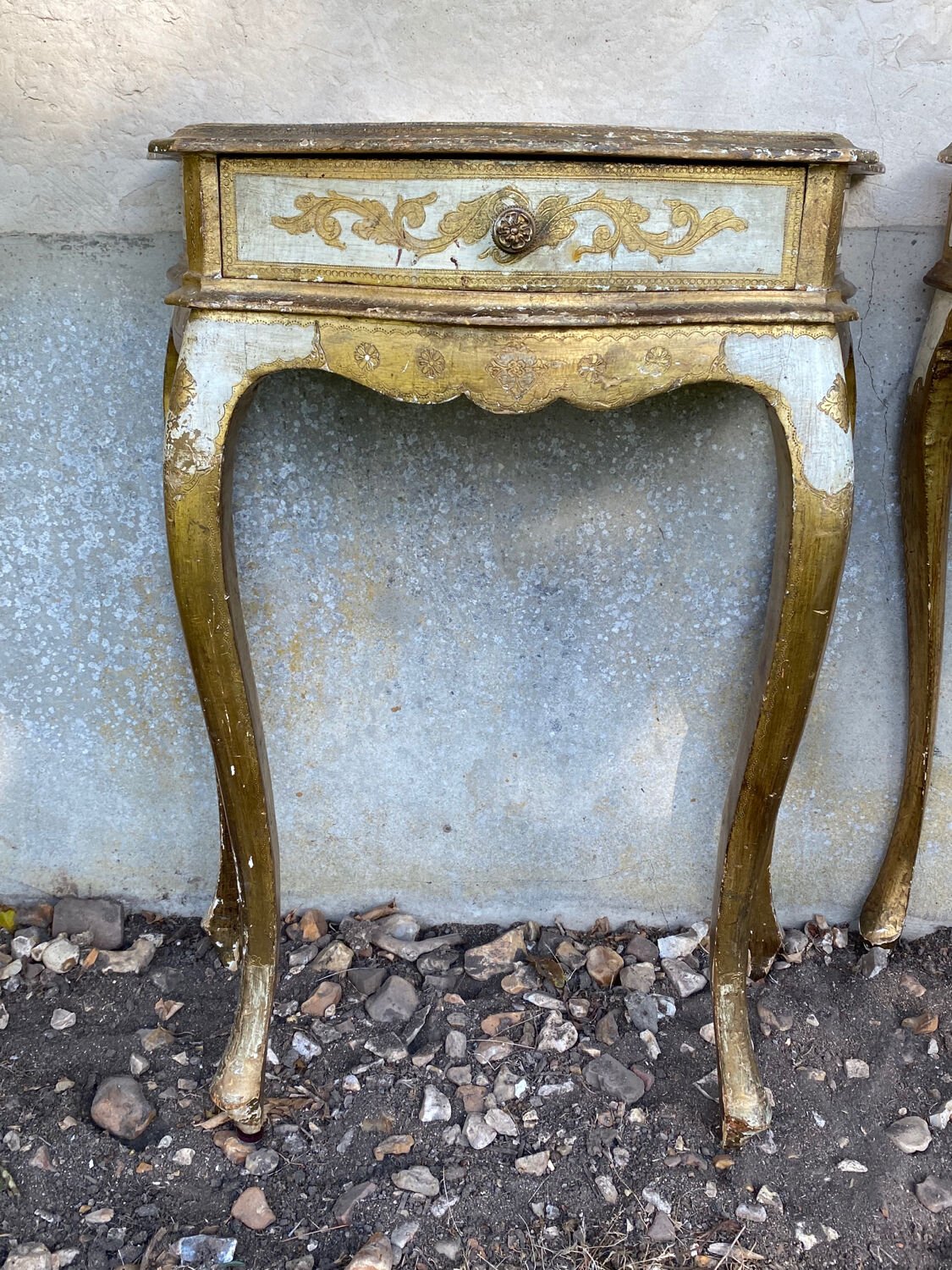 Pairs of Florentine bedside tables in gilded wood.