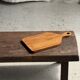 Rectangular solid teak chopping board with elongated handle 30x16.