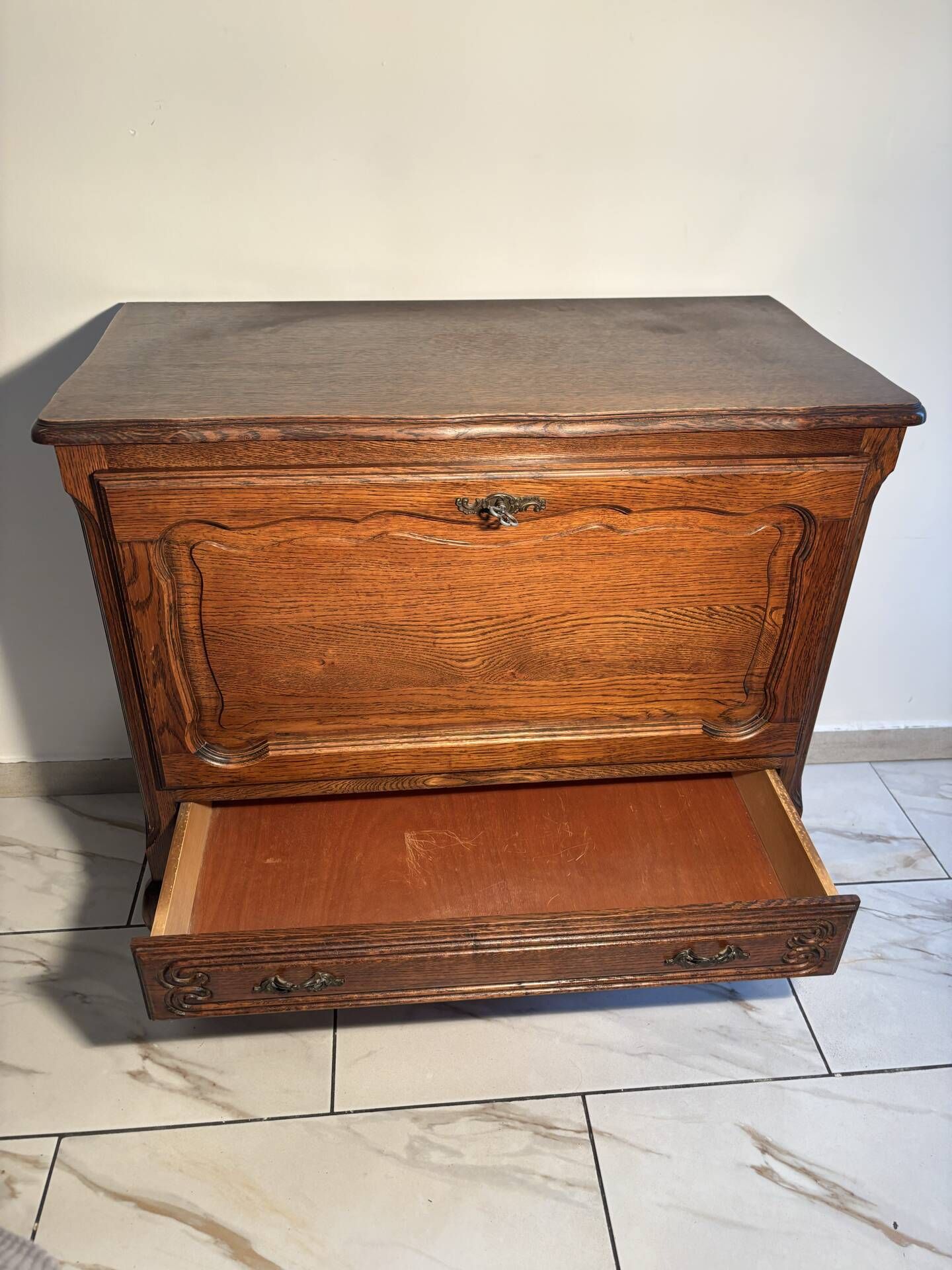 Louis XV style oak TV cabinet with drop-down flap.
