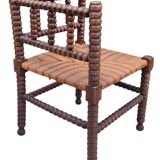 Old corner straw armchair in turned wood