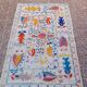 White suzani kilim rug with embroidered colorful patterns