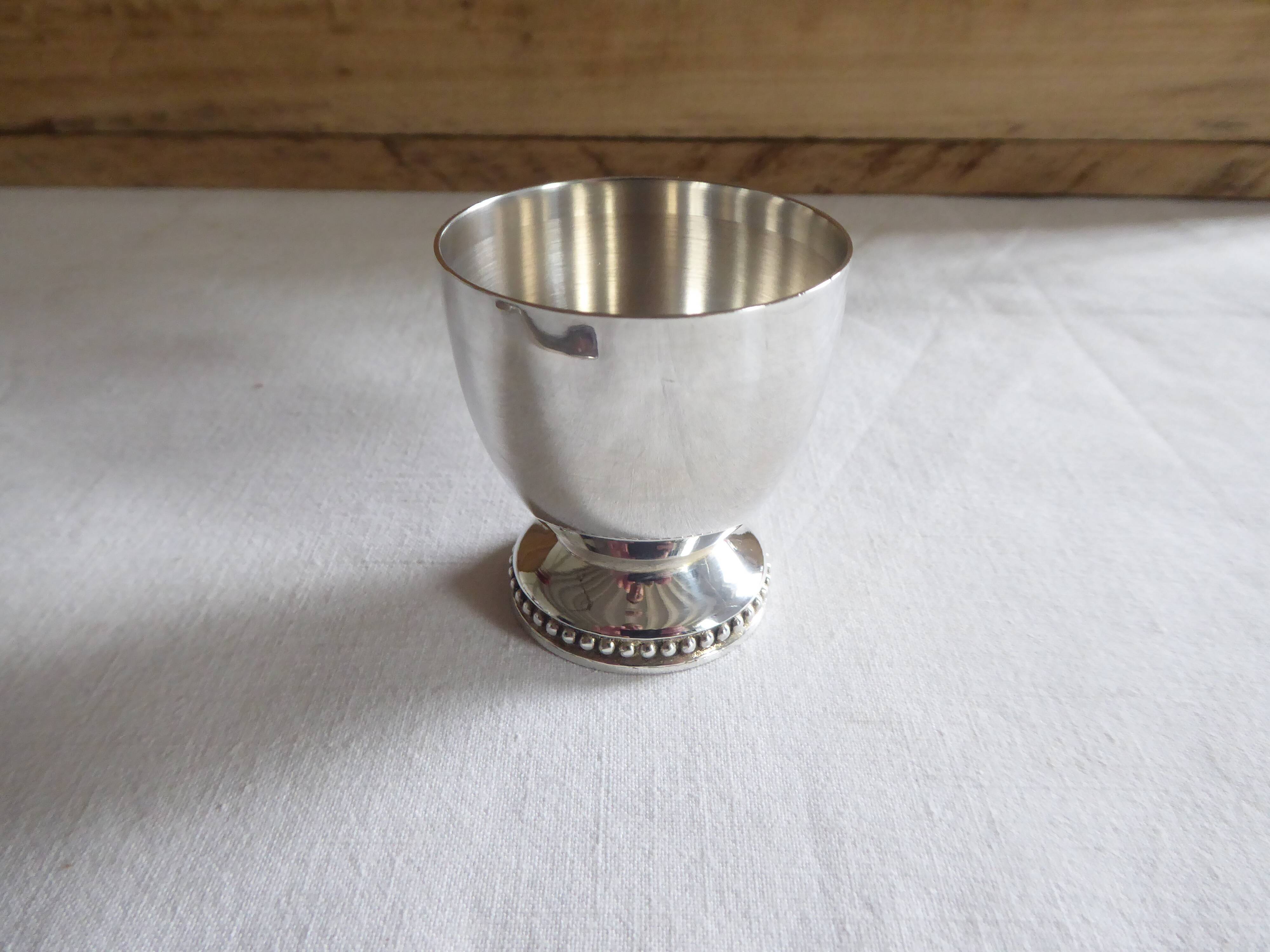 Cockerel + silver metal spoon