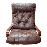 Scandinavian tilting and rotating armchair
