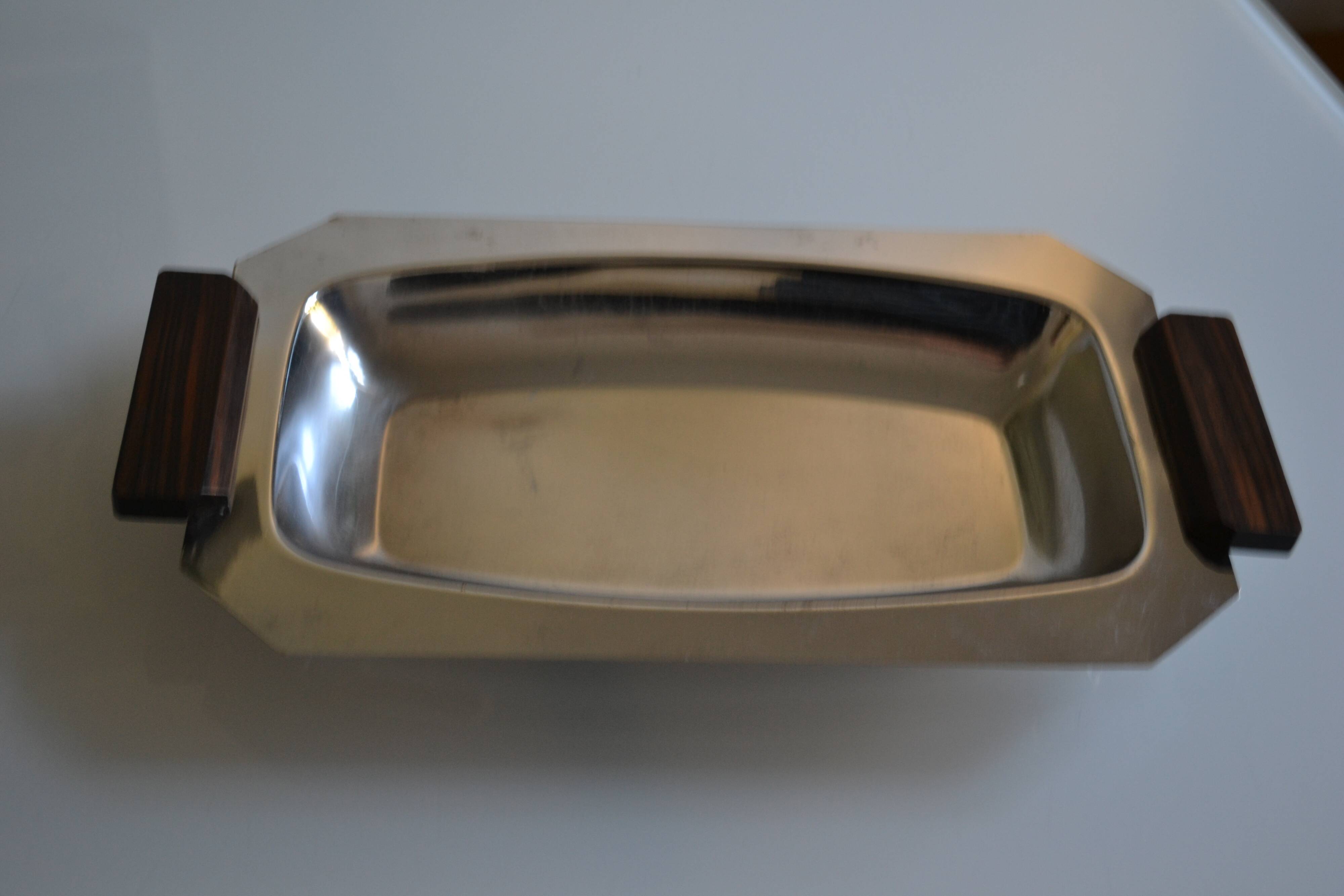 Art Deco serving dish in chrome metal with ebony handles.