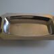 Art Deco serving dish in chrome metal with ebony handles.