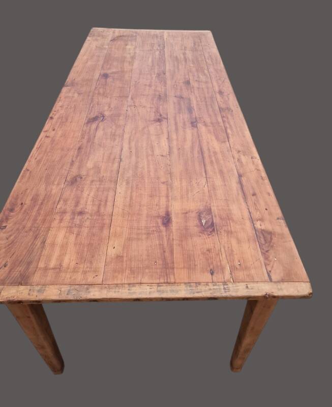 Old farmhouse table with two drawers.