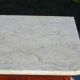 Antique mahogany chest of drawers with white marble.