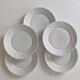 Set of five porcelain dessert plates