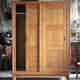 Vintage wooden wardrobe with sliding doors