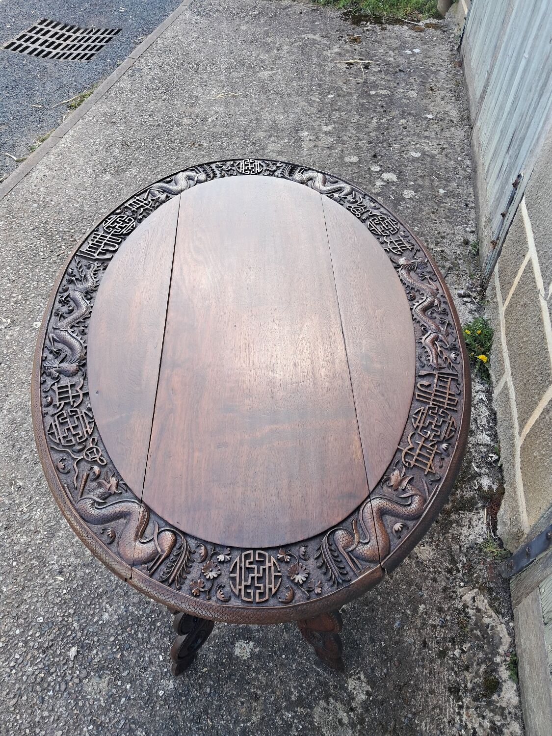 Asian table, mid-height, made of exotic wood.