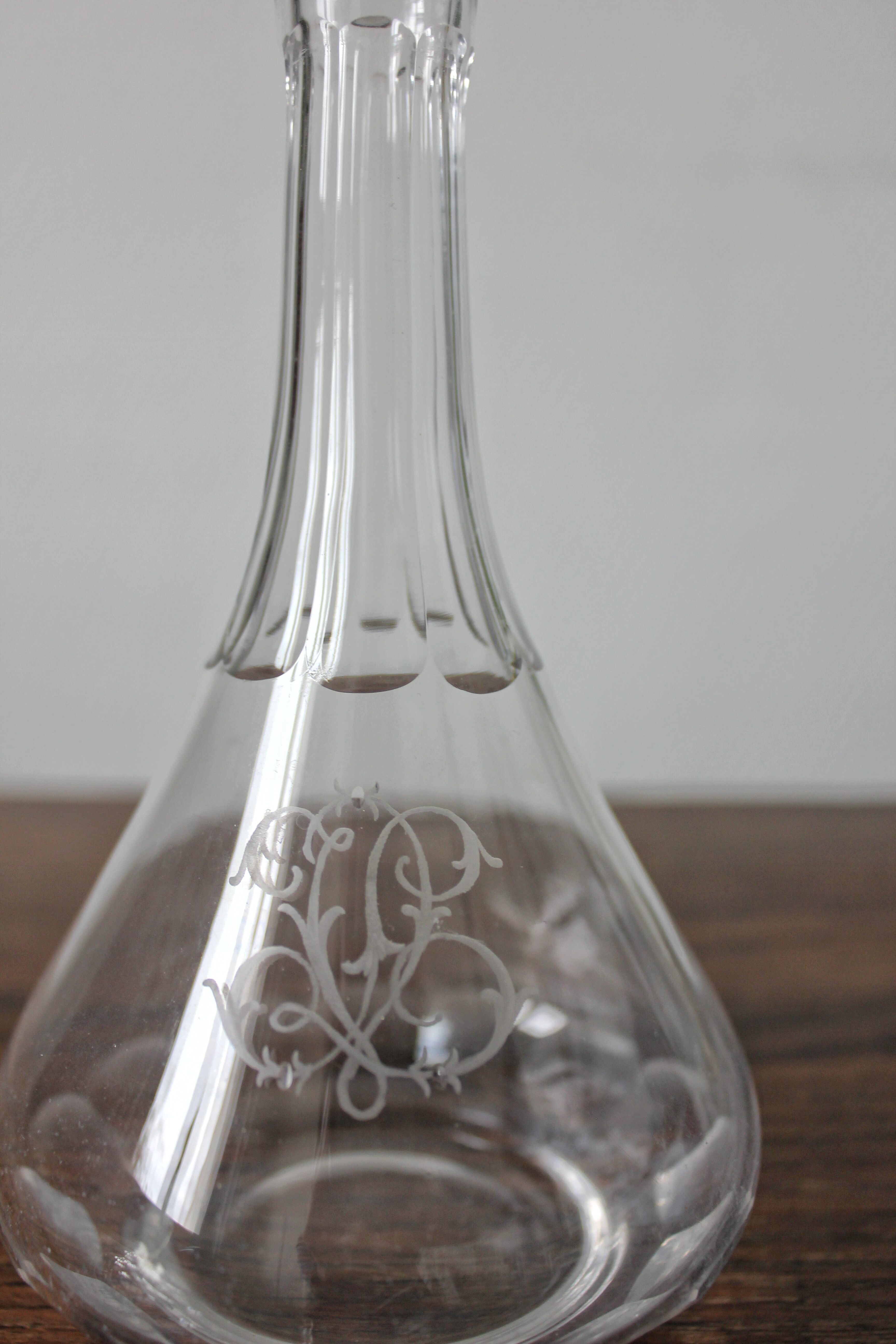 Antique crystal liqueur decanter with engraved monogram and flat ribs