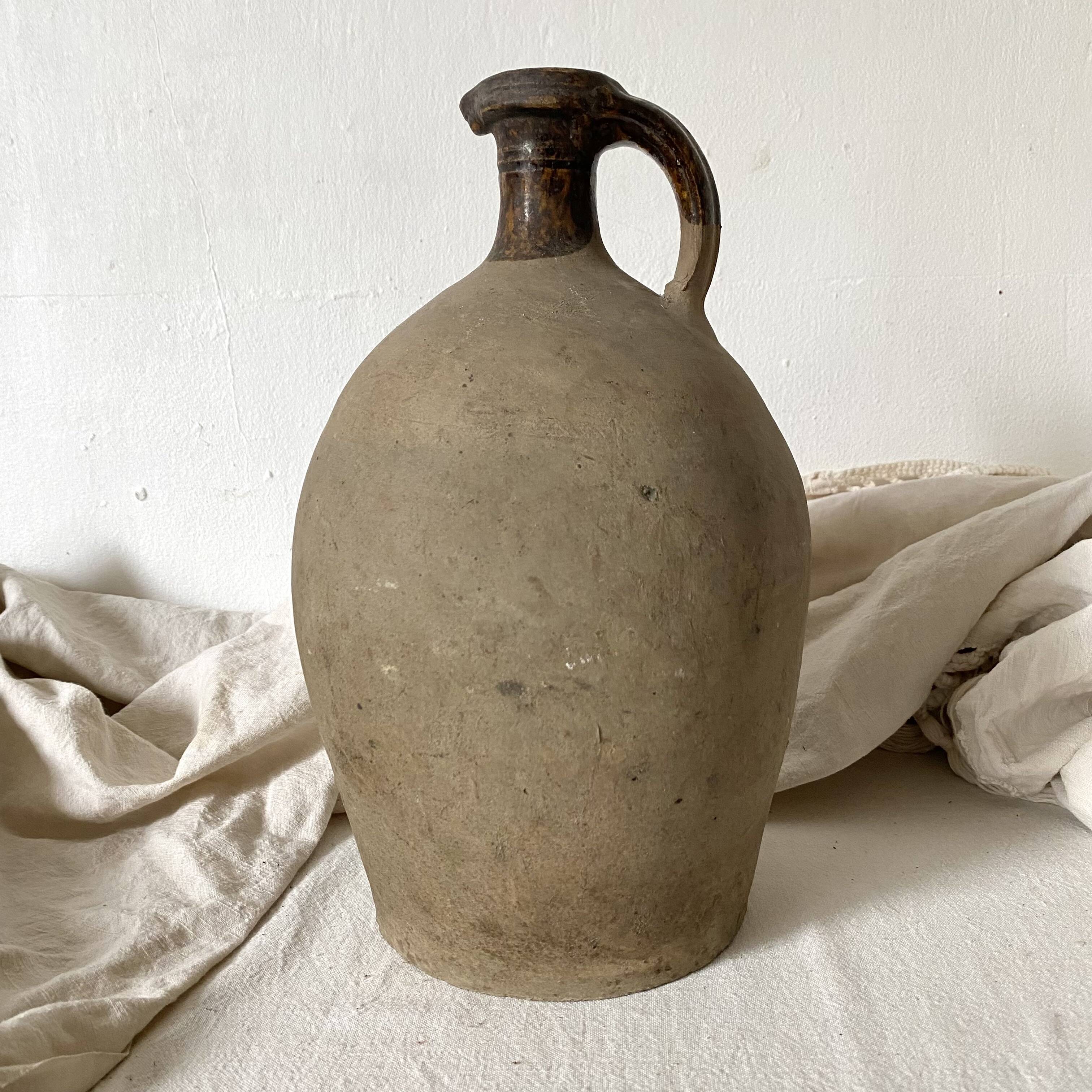 Antique jug, terracotta jar