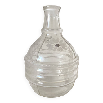 Old carafe, daisy decorated vase