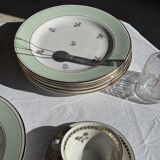 Set of 9 vintage turquoise deep plates with gold trim and pink flowers.