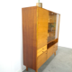 Vintage wooden sideboard with sliding glass doors and drawers