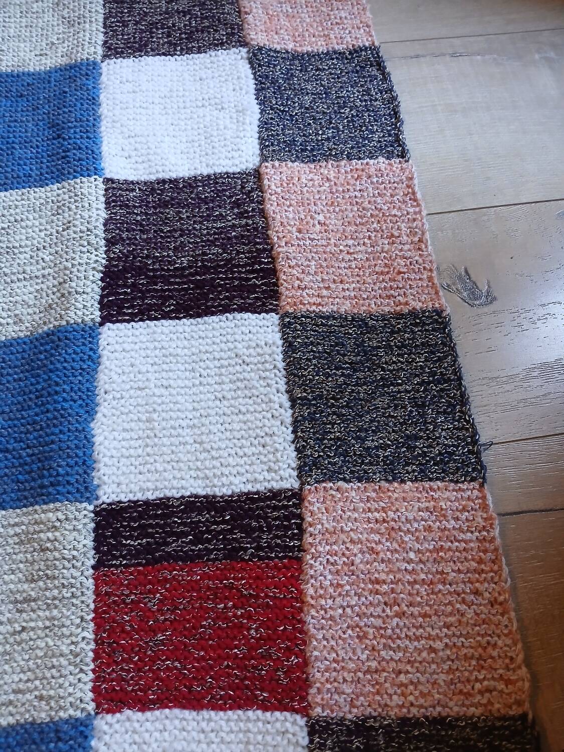 Hand knitted patchwork plaid