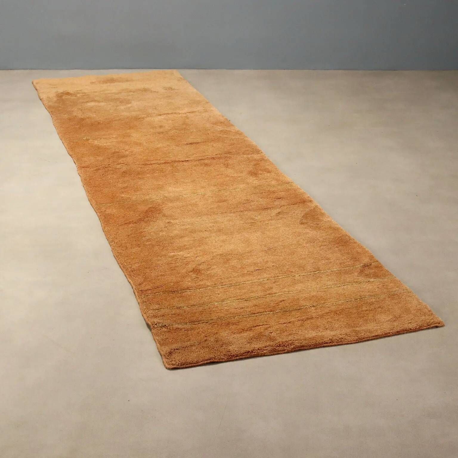 Ancient Asian wool rug, hand-knotted, 118 x 31 in.
