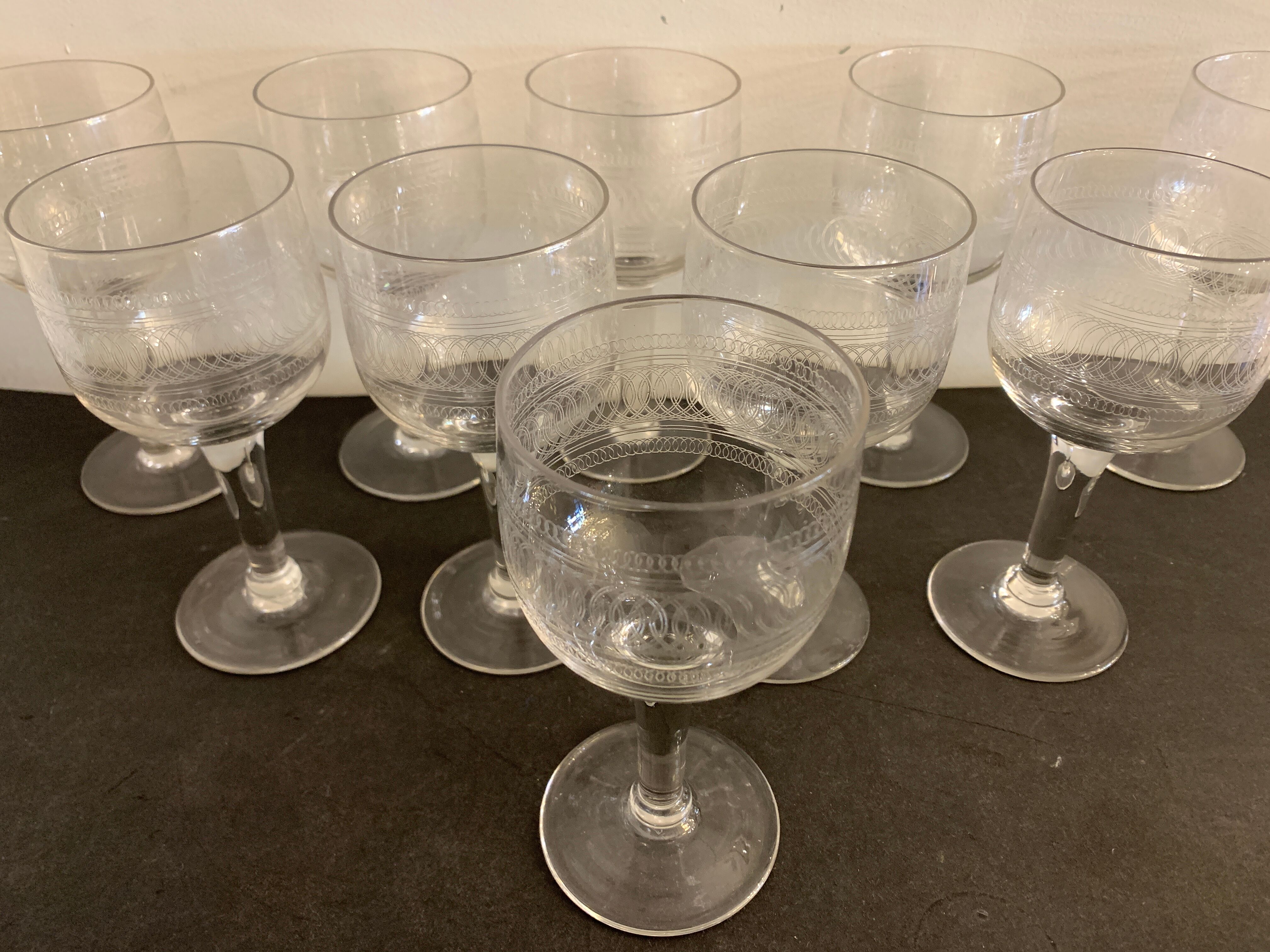 10 blown and engraved stemmed glasses
