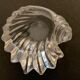 Empty crystal pocket in the shape of a shell