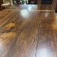 English monastery table with extensions from the late 19th century in elm and oak.