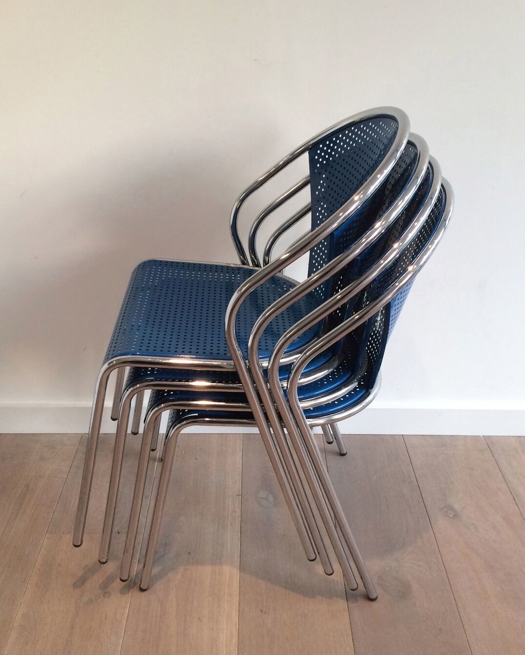 Set of 4 chairs chrome-based perforated metal blue color, around 1980