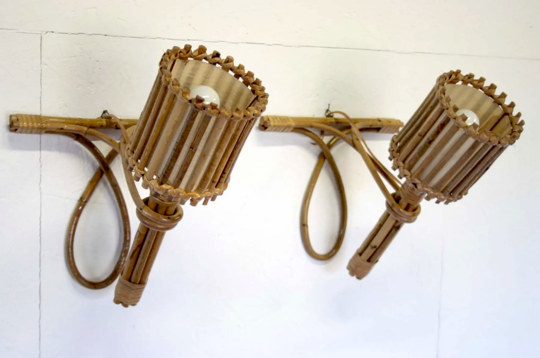 Pair of Louis Sognot rattan sconces