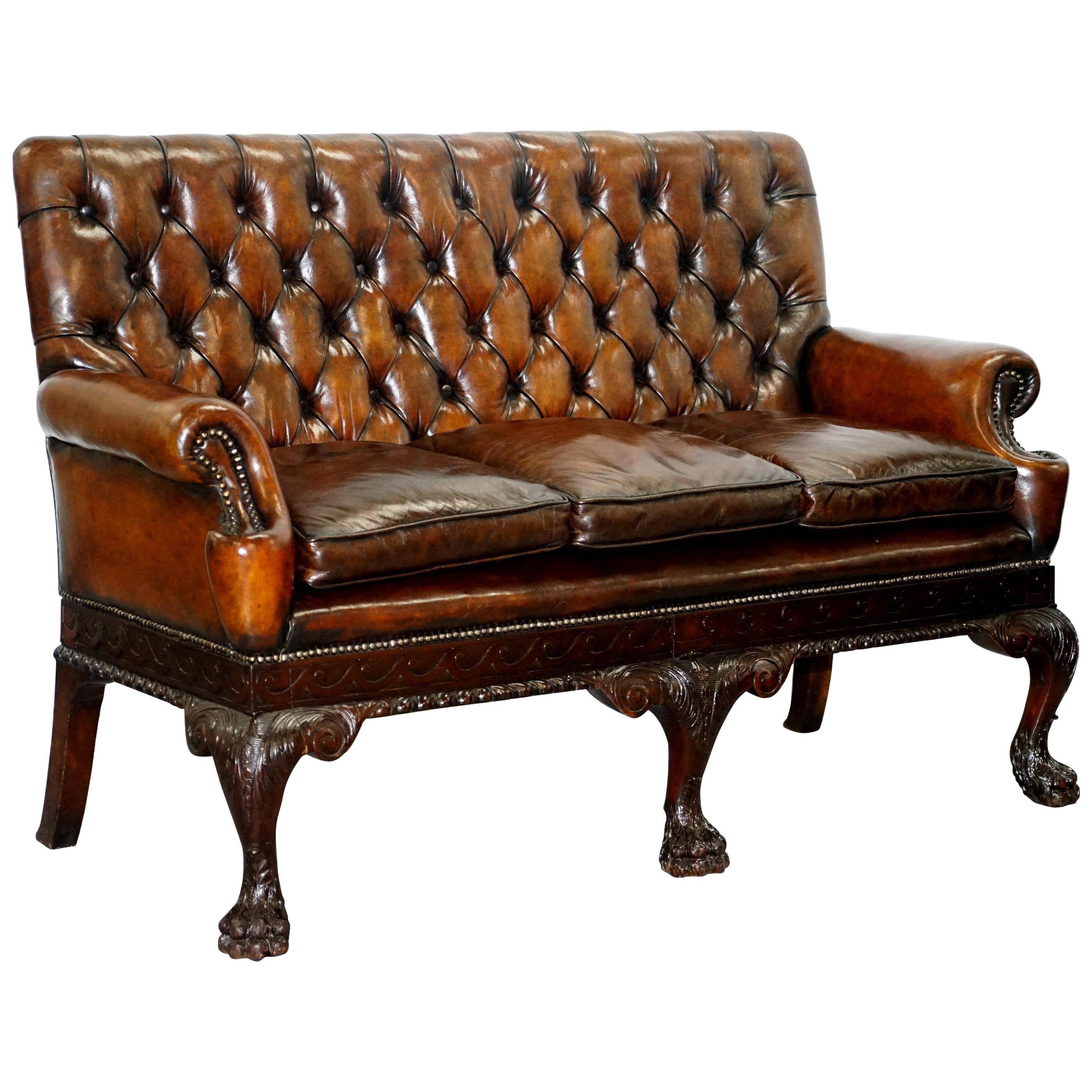 Chesterfield leather canapé in Georgian style with lion paw carved feet.