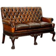 Chesterfield leather canapé in Georgian style with lion paw carved feet.