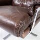 Chaise facile rembourrée avec cuir brun patiné et cadre en métal, conçu par Arne Norell