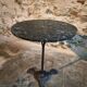 Old French bistro table with a marble top and a cast iron base.