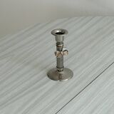 Patinated metal candle holder with knot