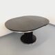 Vintage dining table in melamine with a black wood effect and chrome metal.