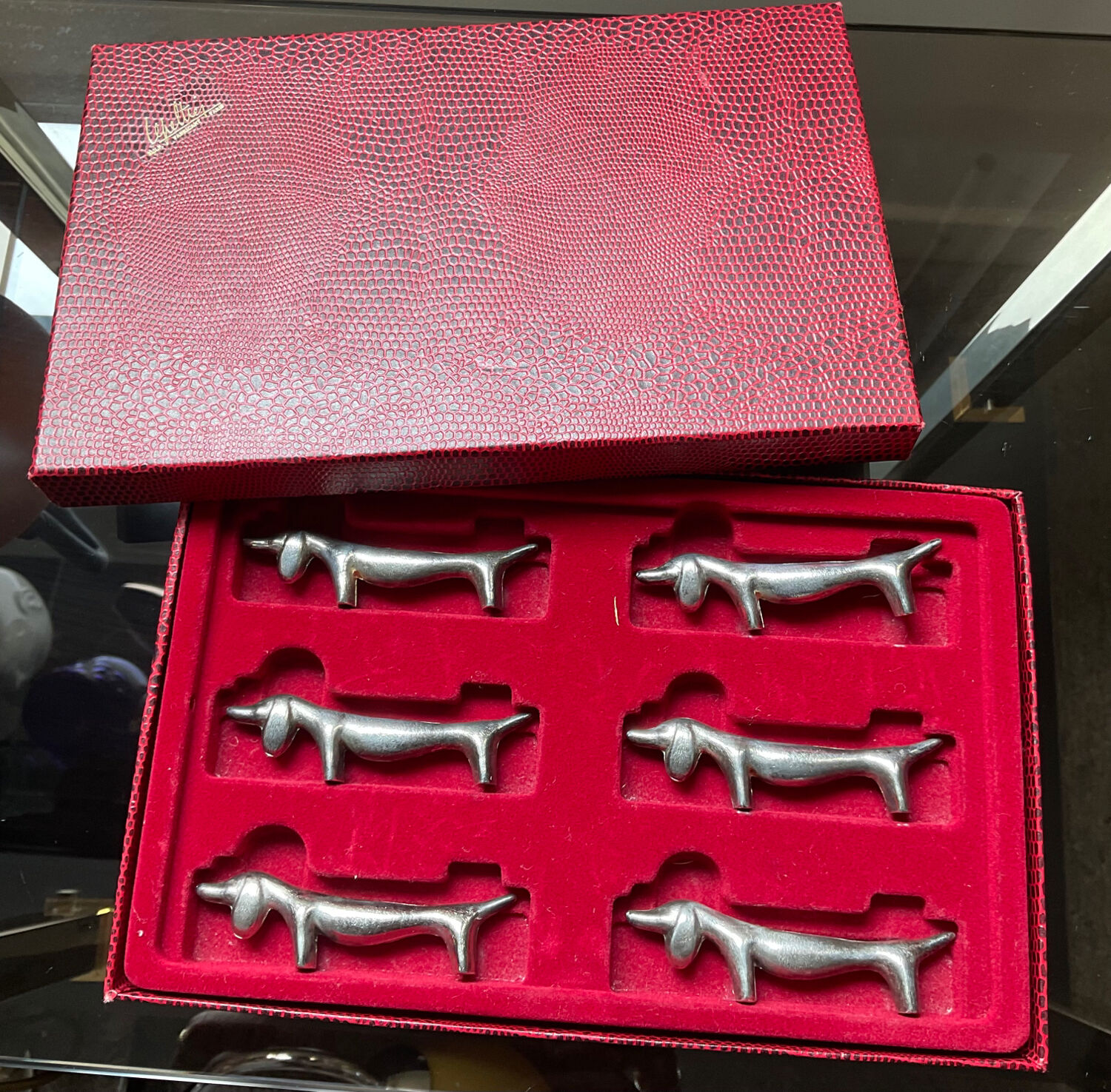 Series of vintage Dachshund knife holders in silver metal