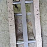 Lampadaire Arc - télescopique - piètement en travertin -