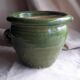 Glazed green terracotta pot.