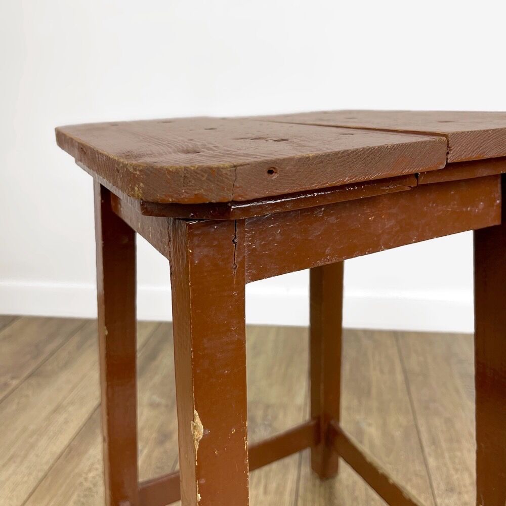 Old solid chocolate wooden stool