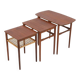 Rare set of three teak nesting tables with cane magazine rack / side tables / mid-century Danish modern design / 1950s / 1960s