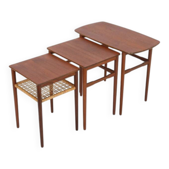 Rare set of three teak nesting tables with cane magazine rack / side tables / mid-century Danish modern design / 1950s / 1960s