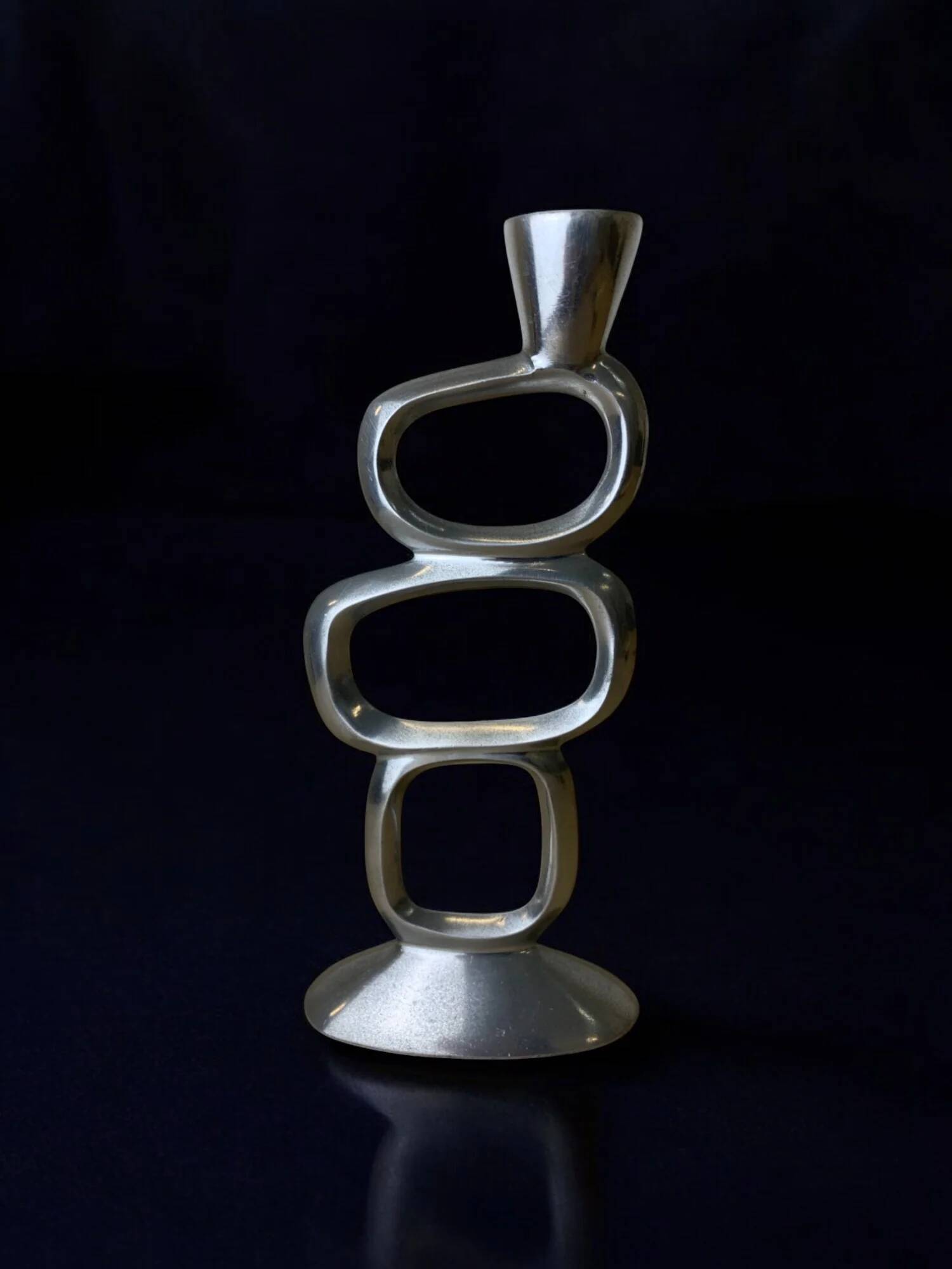 Circle candlestick by Matthew Hilton, solid aluminium, England, 1980s