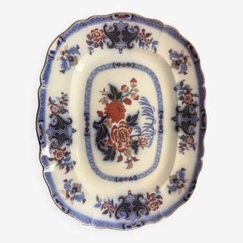 Large hollow dish in fine earthenware with Japanese decoration.